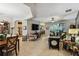 Open and bright living room with multiple seating areas and views into dining and kitchen at 561 Sienna Dr, Poinciana, FL 34759