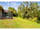 Landscaped backyard with lush greenery and privacy at 561 Sienna Dr, Poinciana, FL 34759