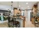 Eat-in kitchen with granite countertops, breakfast bar, and stainless steel appliances at 561 Sienna Dr, Poinciana, FL 34759