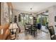 Bright breakfast nook with glass-top table and chairs, adjacent to the kitchen at 561 Sienna Dr, Poinciana, FL 34759