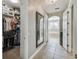 Walk-in closet and bathroom with a large mirror at 561 Sienna Dr, Poinciana, FL 34759