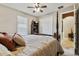 Bright bedroom with a king-size bed and ample closet space at 561 Sienna Dr, Poinciana, FL 34759