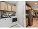 Convenient laundry room with washer, dryer, and ample storage at 561 Sienna Dr, Poinciana, FL 34759