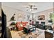 Comfortable living room with leather seating and a large rug at 561 Sienna Dr, Poinciana, FL 34759
