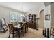 Elegant dining room with a large table and hutch, ideal for gatherings at 561 Sienna Dr, Poinciana, FL 34759