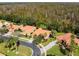 Aerial view of houses with red tile roofs in a residential neighborhood at 561 Sienna Dr, Poinciana, FL 34759