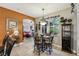 Breakfast nook features a glass-top table and chairs near the kitchen and Gathering room at 561 Sienna Dr, Poinciana, FL 34759