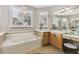 Large bathroom with soaking tub, double vanity, and separate shower at 561 Sienna Dr, Poinciana, FL 34759