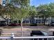 View of a charming street with shops and trees at 660 Celebration Ave # 260, Kissimmee, FL 34747