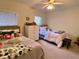 Bedroom with two beds, dresser, and ceiling fan at 660 Celebration Ave # 260, Kissimmee, FL 34747