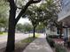 Sidewalk view with trees and local businesses at 660 Celebration Ave # 260, Kissimmee, FL 34747