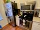 Kitchen features stainless steel appliances including a microwave and refrigerator at 660 Celebration Ave # 260, Kissimmee, FL 34747
