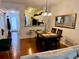 Dining area with dark wood table and chairs, located near kitchen and living room at 660 Celebration Ave # 260, Kissimmee, FL 34747