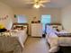 Spacious bedroom with two twin beds and ample closet space at 660 Celebration Ave # 260, Kissimmee, FL 34747