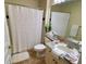 Bathroom with shower/tub combo, white vanity, and granite countertop at 660 Celebration Ave # 260, Kissimmee, FL 34747