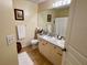Main bathroom with double vanity, granite countertop and a shower/tub combo at 660 Celebration Ave # 260, Kissimmee, FL 34747