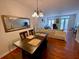 Dining room with a dark wood table and hardwood floors at 660 Celebration Ave # 260, Kissimmee, FL 34747