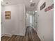 Upstairs hallway with light walls and wood-look flooring at 709 Benoi Dr, Davenport, FL 33896