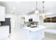 Modern kitchen with white cabinets and stainless steel appliances at 759 Largo Pass, Kissimmee, FL 34759
