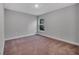 Well-lit bedroom with carpet and a window at 792 Del Prado Dr, Kissimmee, FL 34758