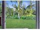 View of backyard and wooded area seen from inside the house at 792 Del Prado Dr, Kissimmee, FL 34758