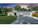 Newly constructed home with a two-car garage and well-manicured lawn at 792 Del Prado Dr, Kissimmee, FL 34758