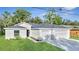 New home exterior with a two-car garage at 792 Del Prado Dr, Kissimmee, FL 34758