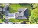 Overhead view of house, driveway, and surrounding landscape at 792 Del Prado Dr, Kissimmee, FL 34758