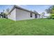 Spacious backyard with grassy area and home exterior partially visible at 792 Del Prado Dr, Kissimmee, FL 34758