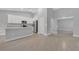 Spacious kitchen with island, granite counters and stainless steel appliances at 792 Del Prado Dr, Kissimmee, FL 34758