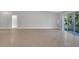 Bright living room with tile floors and large windows at 792 Del Prado Dr, Kissimmee, FL 34758