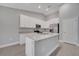 Open kitchen with island, granite counters, and stainless steel appliances at 792 Del Prado Dr, Kissimmee, FL 34758