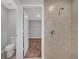 Bathroom with toilet, shower and access to closet at 792 Del Prado Dr, Kissimmee, FL 34758