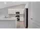 Modern kitchen with white cabinets and stainless steel appliances at 792 Del Prado Dr, Kissimmee, FL 34758