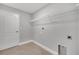 Laundry room with shelving and tile flooring at 792 Del Prado Dr, Kissimmee, FL 34758