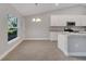 Modern kitchen with white cabinets and granite countertops at 792 Del Prado Dr, Kissimmee, FL 34758