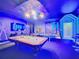 Game room boasts pool table, ping pong, and vibrant murals at 9158 Wedge Dr, Davenport, FL 33896