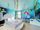 Under the sea themed bedroom with a round bed and mural at 9158 Wedge Dr, Davenport, FL 33896