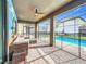 Covered patio with pool, seating, and fun mural at 9158 Wedge Dr, Davenport, FL 33896