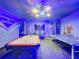 Game room features pool table, ping pong, and themed murals at 9158 Wedge Dr, Davenport, FL 33896