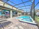 Screened pool and spa with fun Disney mural at 9158 Wedge Dr, Davenport, FL 33896