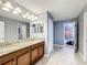 Bathroom with double vanity and granite countertop at 9158 Wedge Dr, Davenport, FL 33896
