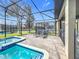 Enjoy the screened pool and spa area at 9158 Wedge Dr, Davenport, FL 33896
