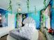 Mermaid bedroom with a round bed and ocean-themed decor at 9158 Wedge Dr, Davenport, FL 33896