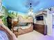 Bunk beds in a rustic-themed bedroom with a mural at 9158 Wedge Dr, Davenport, FL 33896
