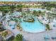 Aerial view of a large resort-style pool with landscaping at 9158 Wedge Dr, Davenport, FL 33896