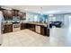 Open kitchen with stainless steel appliances and granite countertops at 9158 Wedge Dr, Davenport, FL 33896