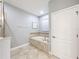 Bathroom with a soaking tub and tiled walls at 9158 Wedge Dr, Davenport, FL 33896
