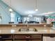 Kitchen with a double sink and granite countertops at 9158 Wedge Dr, Davenport, FL 33896