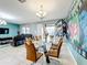 Dining area with a glass table and six chairs at 9158 Wedge Dr, Davenport, FL 33896
